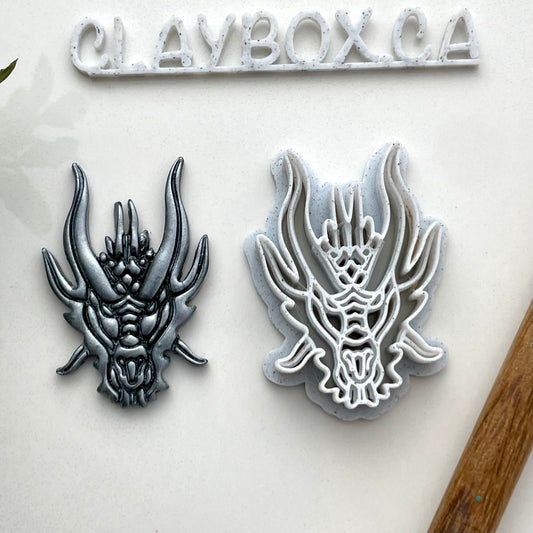 Dragon head combined stamp/cutter