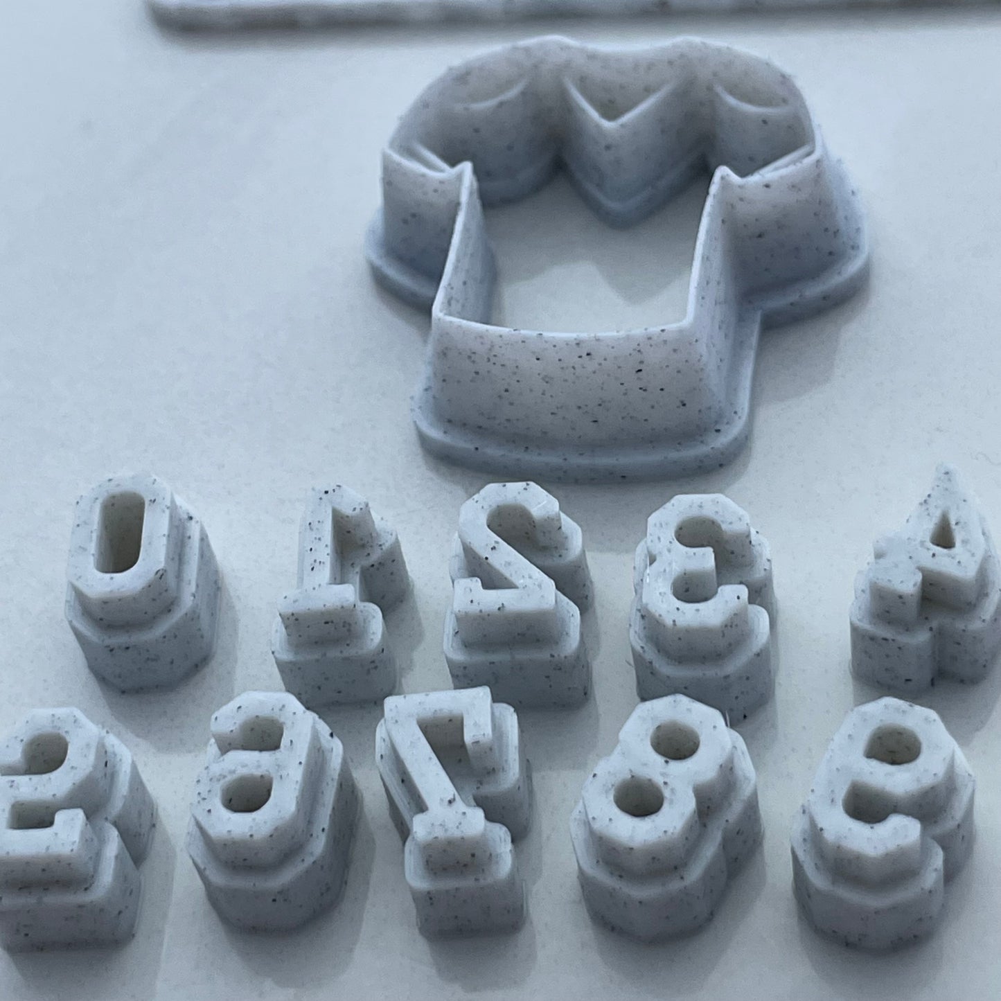 Football jersey cutter with number stamps