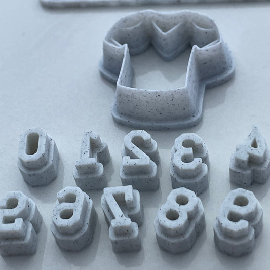 Football jersey cutter with number stamps