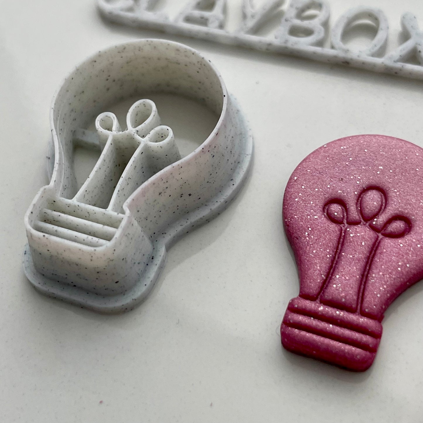 Lightbulb combined stamp/cutter